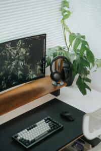 An example of an ergonomic work station. A laptop sits on a stand elevated a few inches above the desk surface.